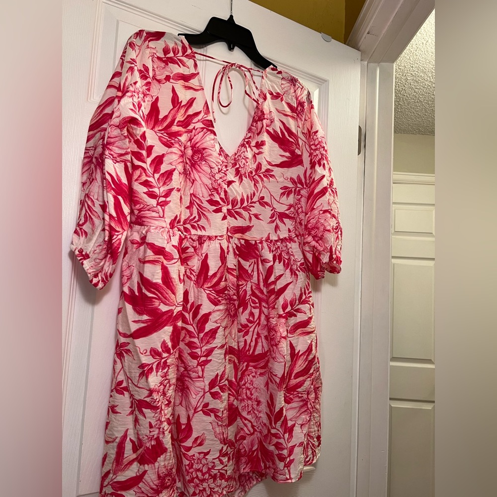 New H&M dress very flattering. Never worn. Too big for me